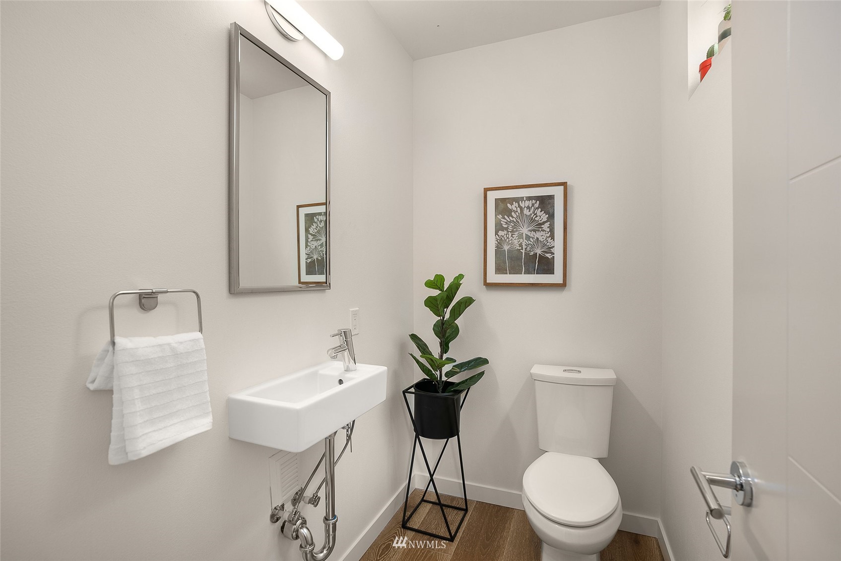 4207 Southwest Frontenac Street Seattle, WA 98136 - Photo 12 of 36 a white toilet sitting next to a bathroom sink