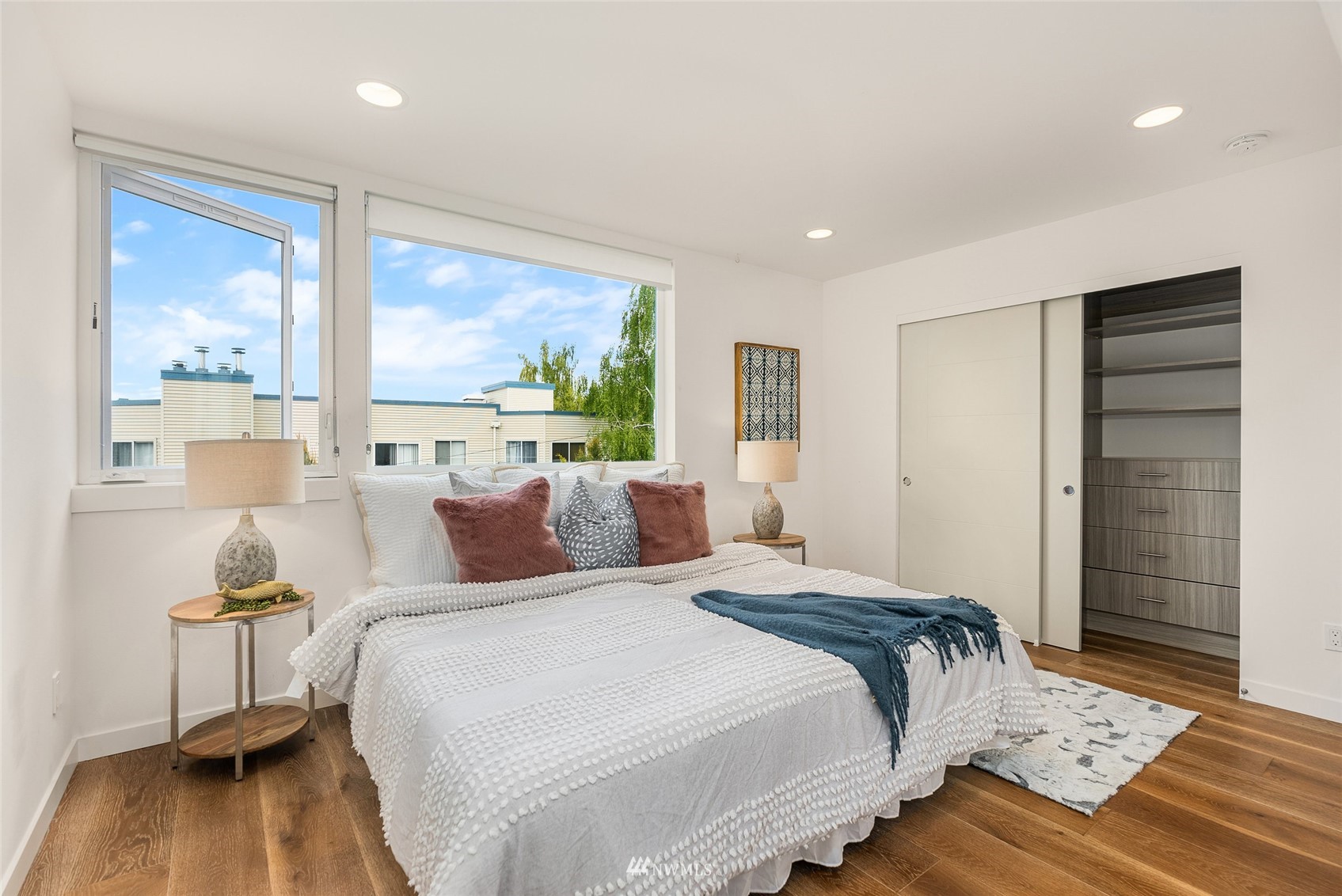 4207 Southwest Frontenac Street Seattle, WA 98136 - Photo 13 of 36 a bedroom with a large bed and a window