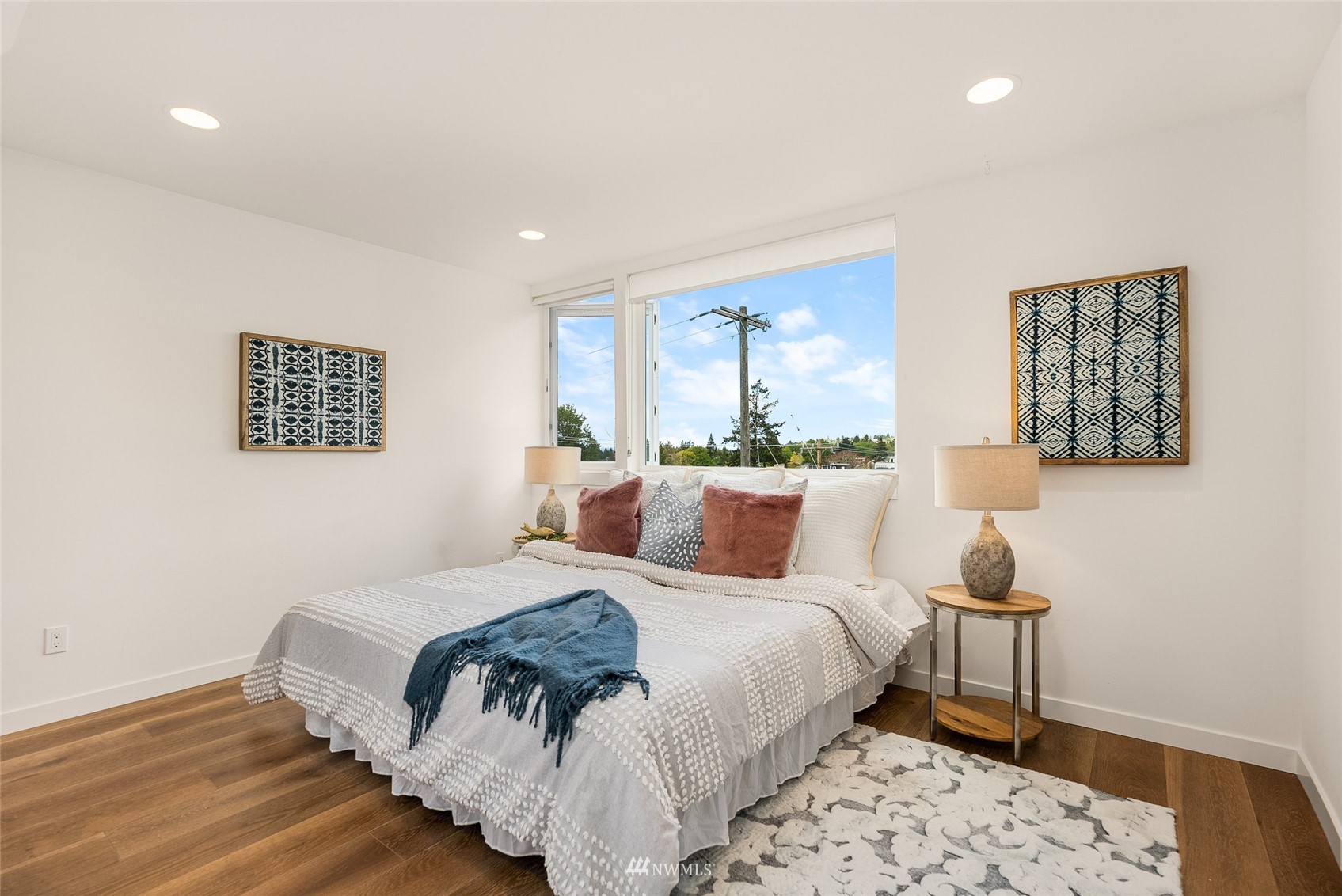 4207 Southwest Frontenac Street Seattle, WA 98136 - Photo 14 of 36 a bedroom with bed and wooden floor
