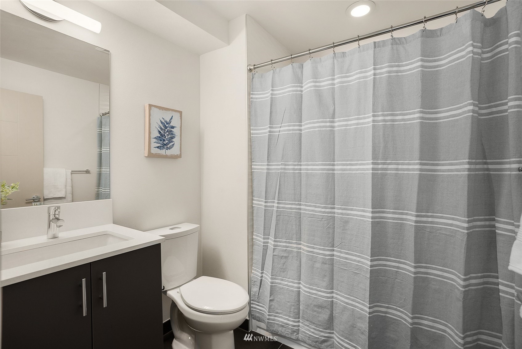 4207 Southwest Frontenac Street Seattle, WA 98136 - Photo 18 of 36 a bathroom with a sink toilet and shower