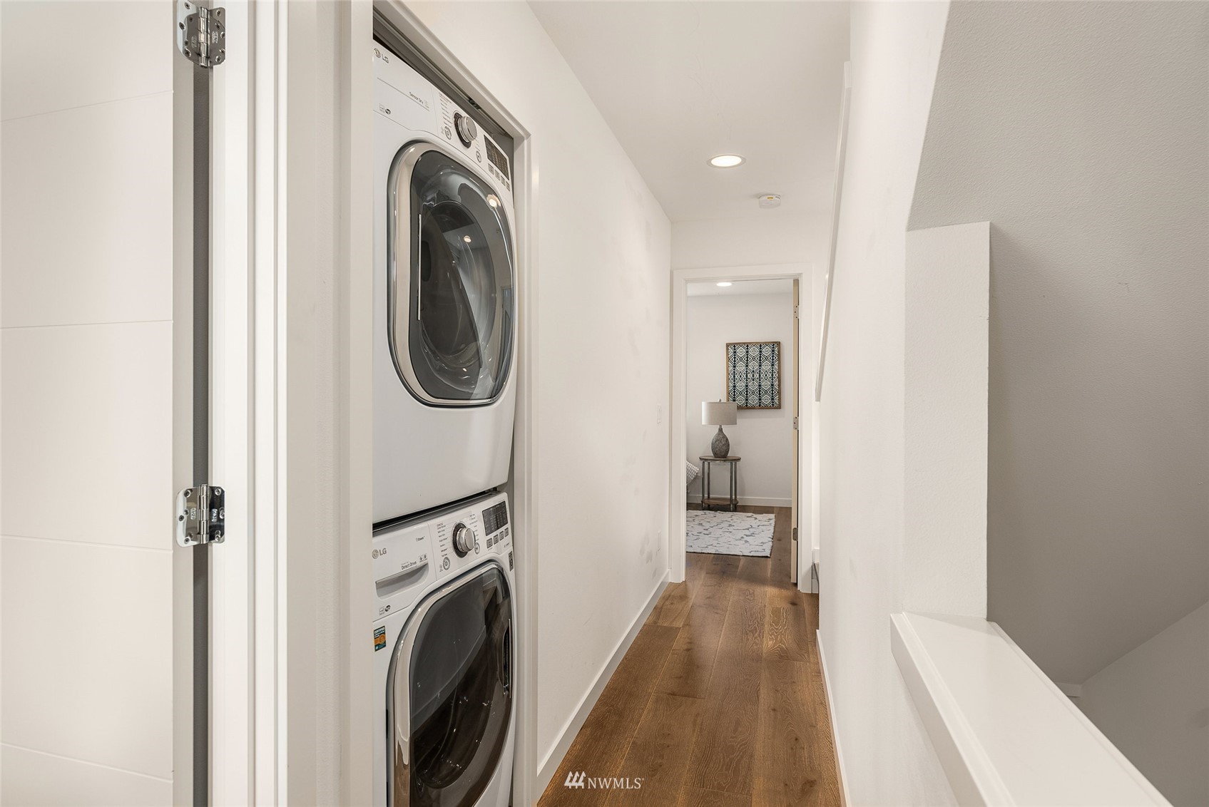4207 Southwest Frontenac Street Seattle, WA 98136 - Photo 19 of 36 a view of a hallway with washer and dryer