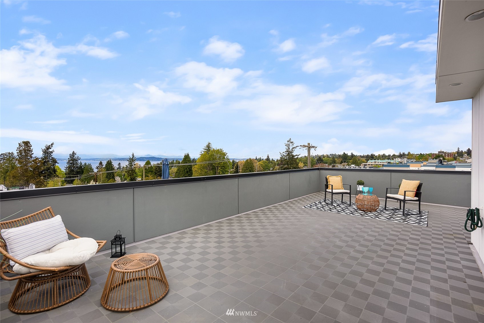 4207 Southwest Frontenac Street Seattle, WA 98136 - Photo 21 of 36 a terrace with outdoor seating and city view