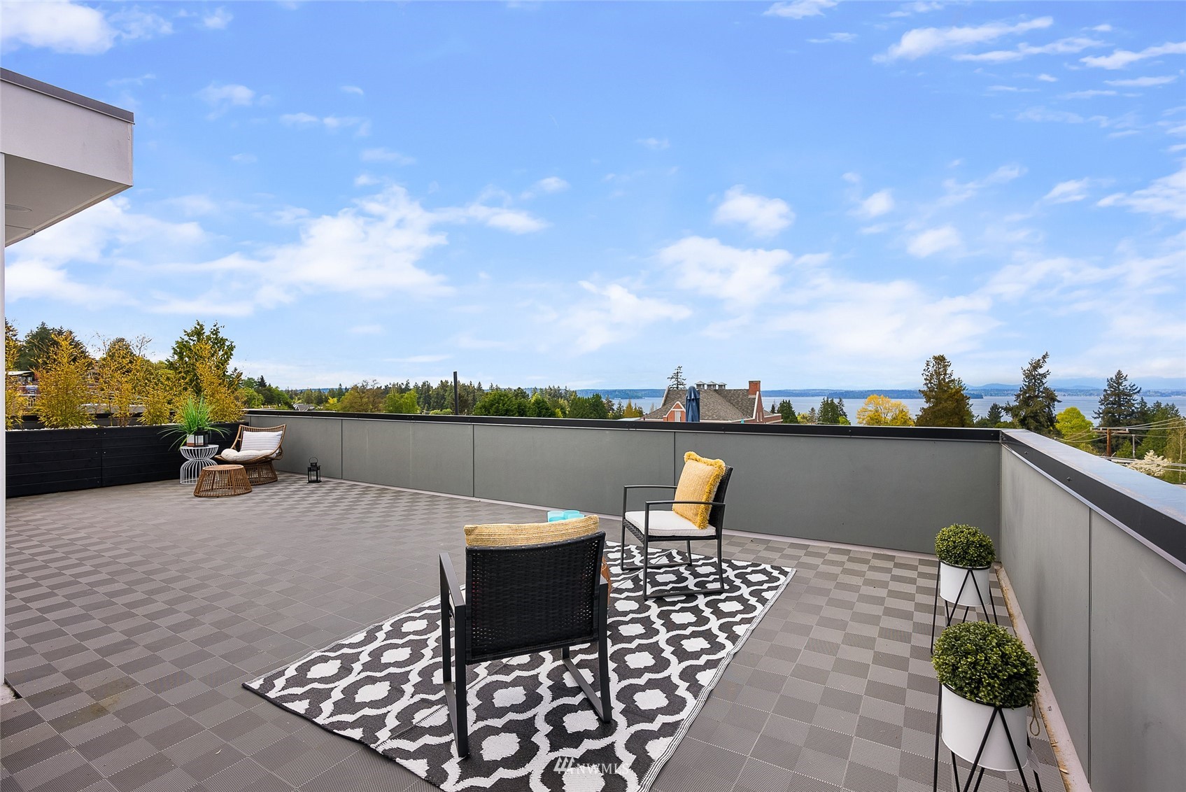 4207 Southwest Frontenac Street Seattle, WA 98136 - Photo 22 of 36 a view of a terrace with furniture