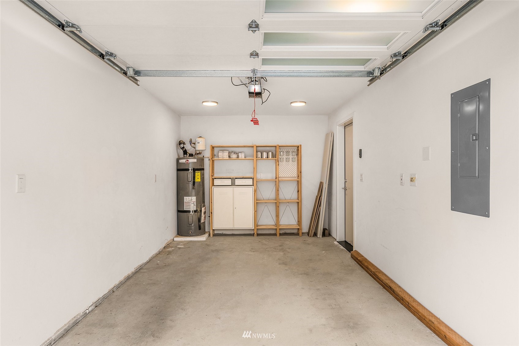 4207 Southwest Frontenac Street Seattle, WA 98136 - Photo 24 of 36 a view of a hallway with a ceiling fan
