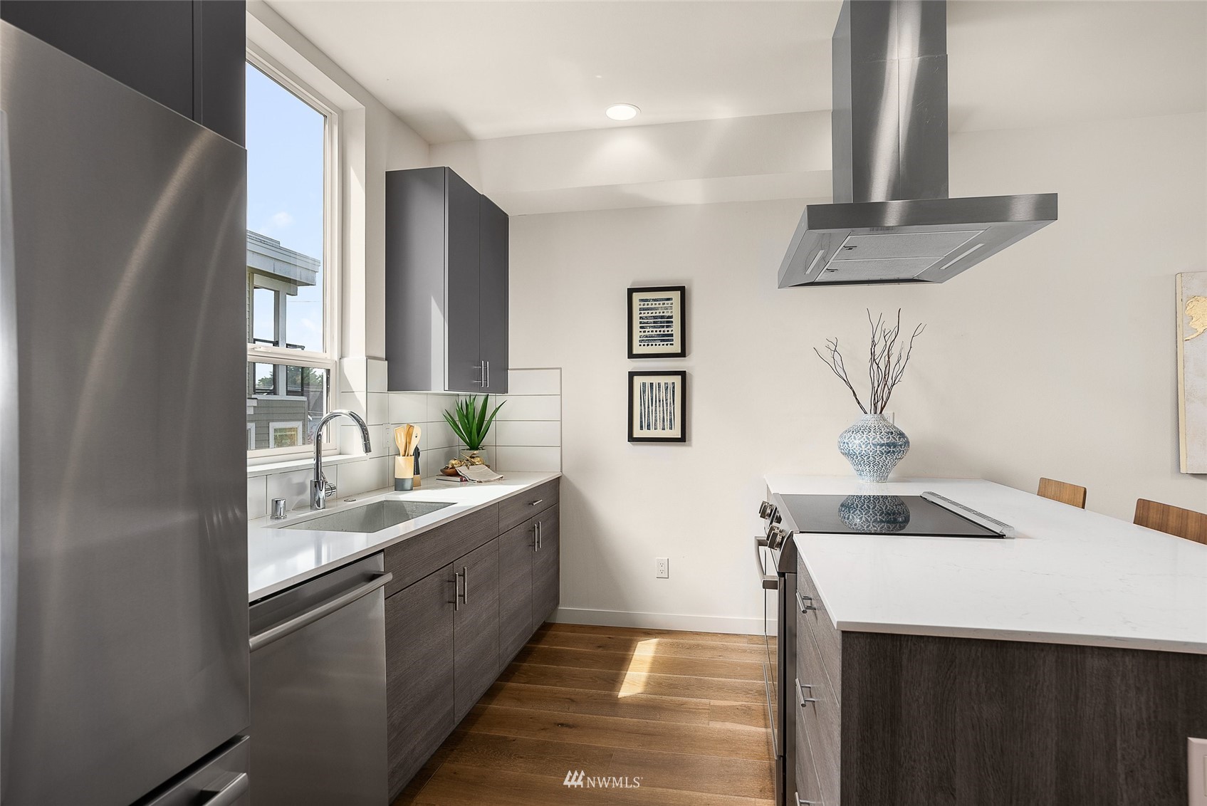4207 Southwest Frontenac Street Seattle, WA 98136 - Photo 5 of 36 a kitchen with a sink and a refrigerator