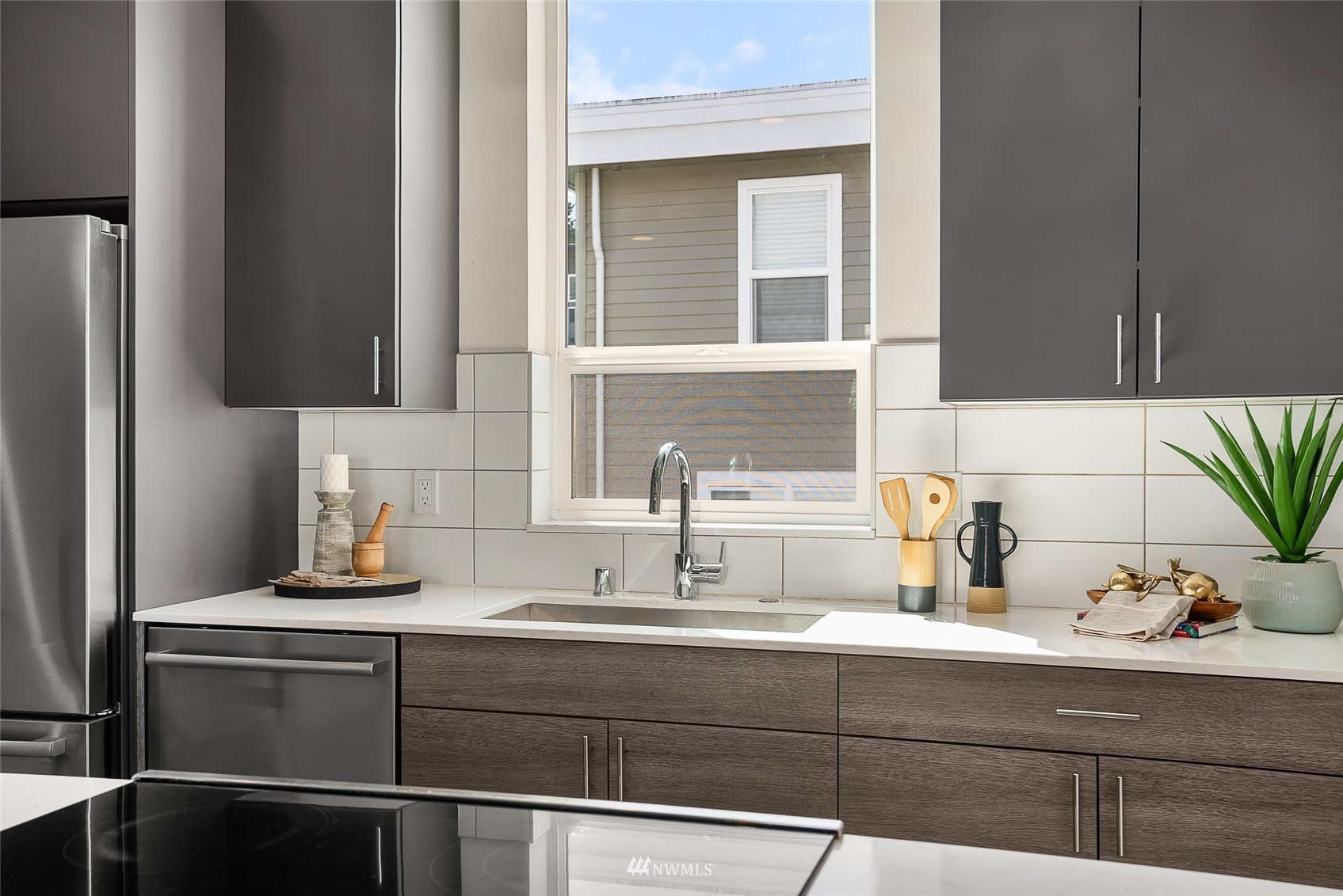 4207 Southwest Frontenac Street Seattle, WA 98136 - Photo 7 of 36 a bathroom with a sink and a mirror