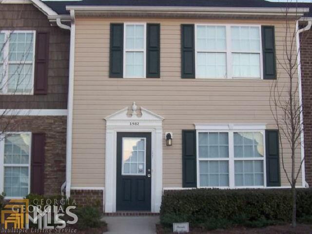 1982 Grove Way Hampton, GA 30228 - Photo 1 of 1 a front view of a house
