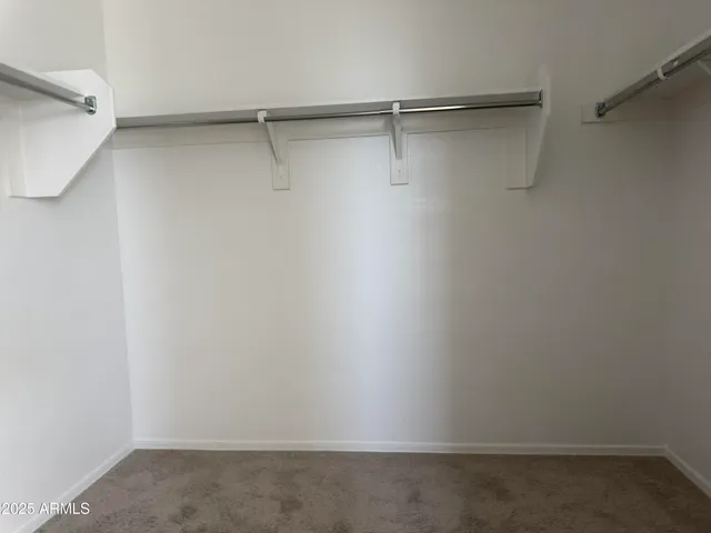 a view of an empty walk in closet