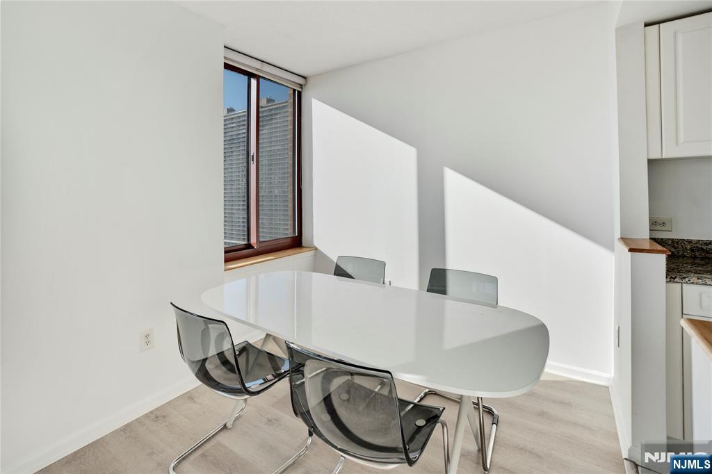 100 Old Palisade Road, Unit 2709 Fort Lee, NJ 07024 - Photo 6 of 15 a balcony with table and chairs