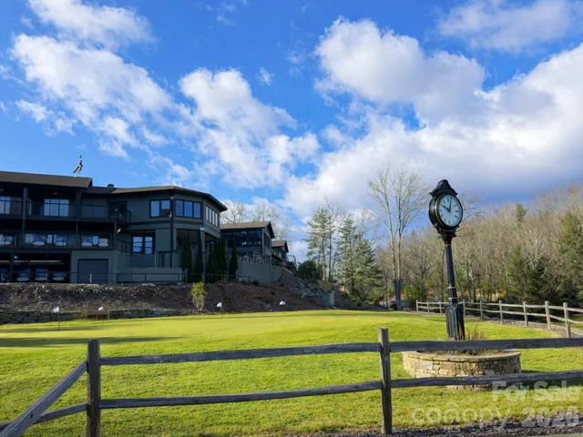 a view of swimming pool is middle in the garden