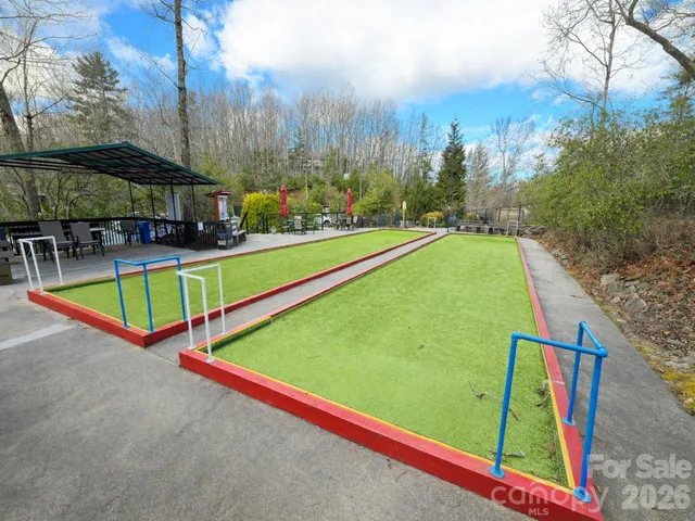 swimming pool with an outdoor seating and yard