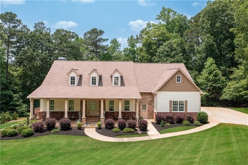 7131 Ridge Road Hiram, GA 30141 - Photo 1 of 63 a front view of a house with garden and porch