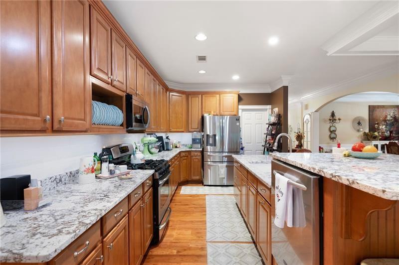 7131 Ridge Road Hiram, GA 30141 - Photo 15 of 63 a kitchen with stainless steel appliances granite countertop counter space cabinets a sink and a wooden floor