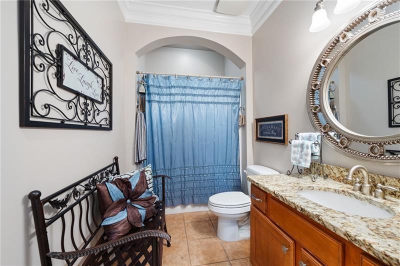 7131 Ridge Road Hiram, GA 30141 - Photo 26 of 63 a bathroom with a granite countertop sink mirror vanity and toilet
