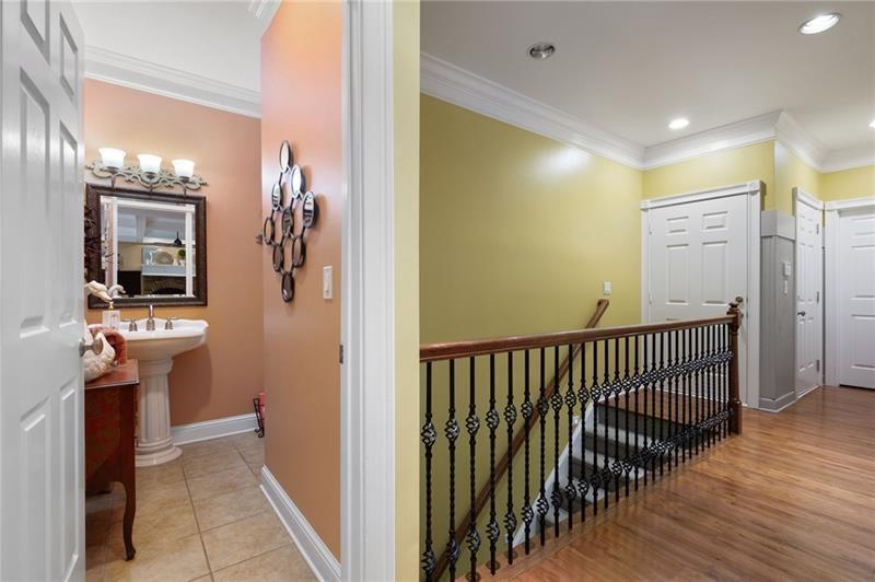 7131 Ridge Road Hiram, GA 30141 - Photo 27 of 63 a view of hallway with a mirror and a wooden floor