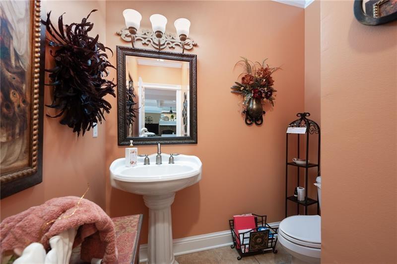 7131 Ridge Road Hiram, GA 30141 - Photo 28 of 63 a bathroom with a sink mirror and toilet