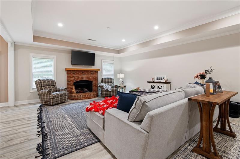 7131 Ridge Road Hiram, GA 30141 - Photo 37 of 63 a living room with furniture a flat screen tv and a fireplace
