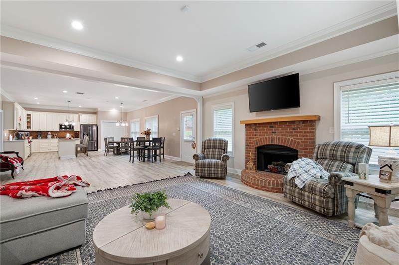 7131 Ridge Road Hiram, GA 30141 - Photo 39 of 63 a living room with furniture fireplace and flat screen tv