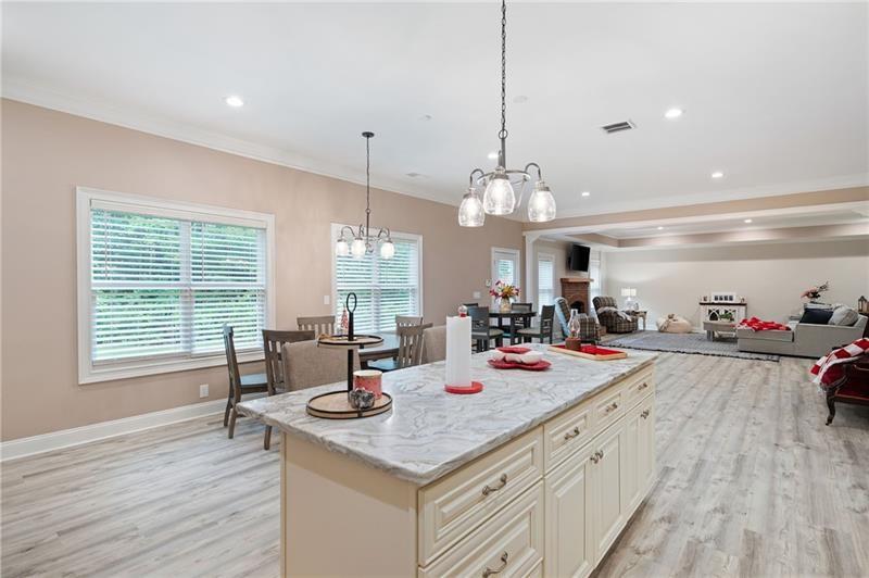 7131 Ridge Road Hiram, GA 30141 - Photo 43 of 63 a view of a dining room and livingroom with furniture wooden floor a chandelier