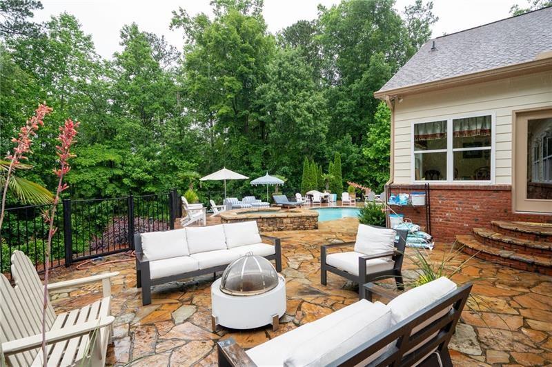 7131 Ridge Road Hiram, GA 30141 - Photo 54 of 63 a view of a patio with couches table and chairs and potted plants