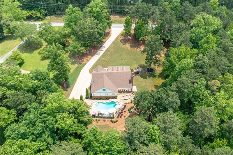 7131 Ridge Road Hiram, GA 30141 - Photo 57 of 63 an aerial view of residential house with outdoor space and trees all around