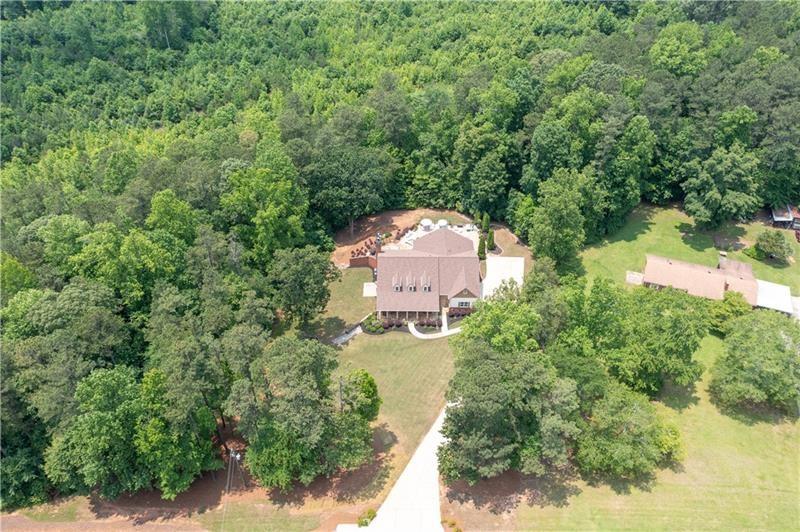 7131 Ridge Road Hiram, GA 30141 - Photo 58 of 63 an aerial view of a house with a yard and lake view