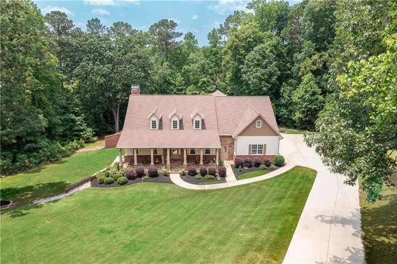 7131 Ridge Road Hiram, GA 30141 - Photo 59 of 63 a view of a house with a big yard and large trees