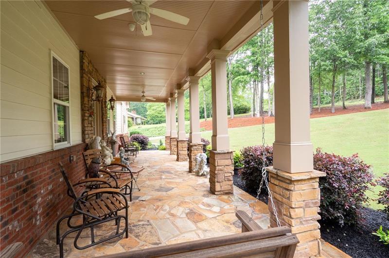 7131 Ridge Road Hiram, GA 30141 - Photo 6 of 63 a living room with patio furniture and floor to ceiling windows