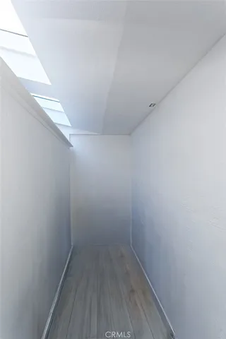 a bedroom with bed and a window