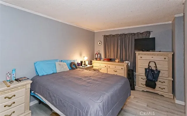 a bedroom with a bed and a closet