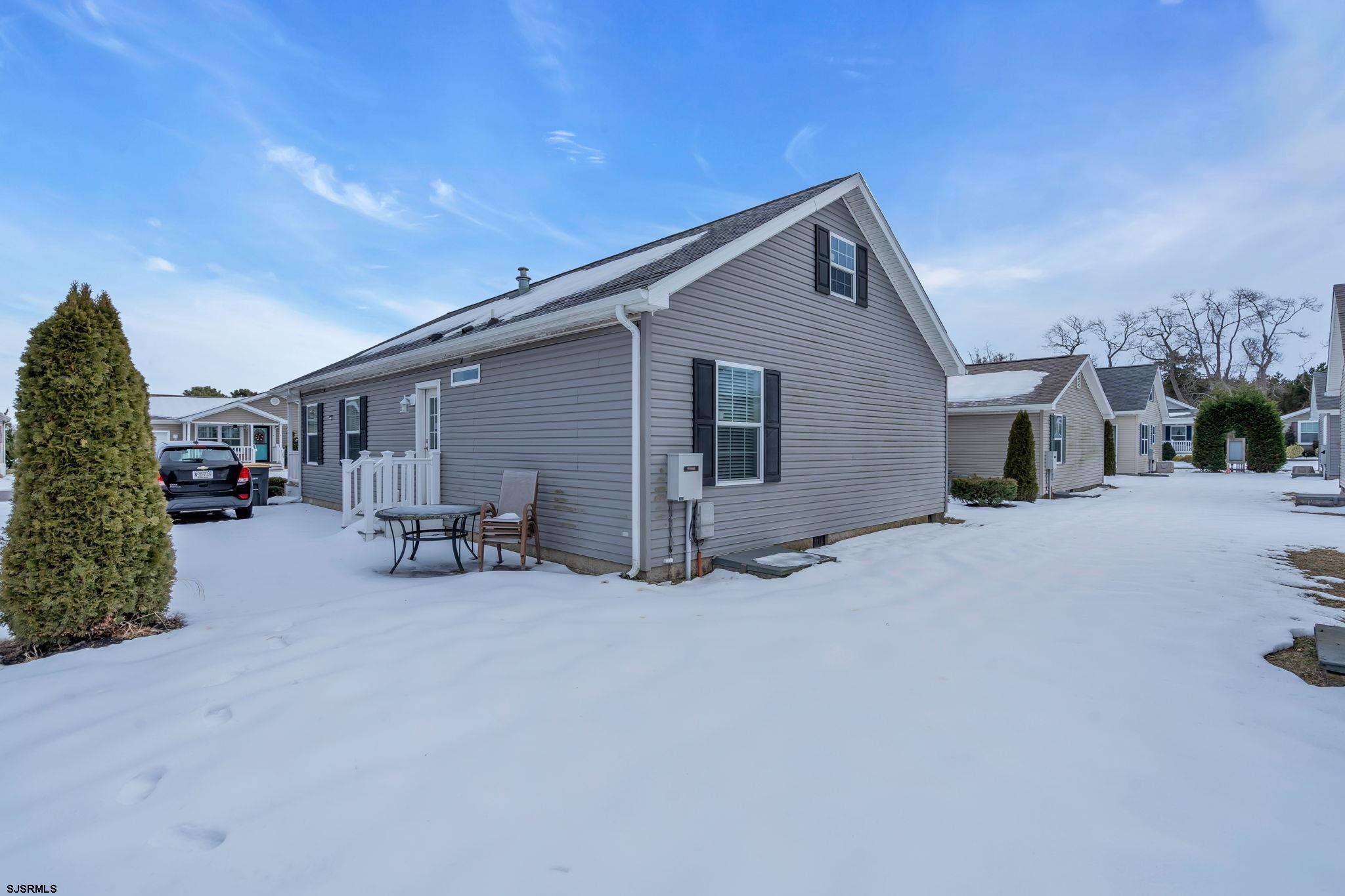 2058 South Shore Road, Unit 104 Marmora, NJ 08230 - Photo 17 of 20 a view of a house with patio