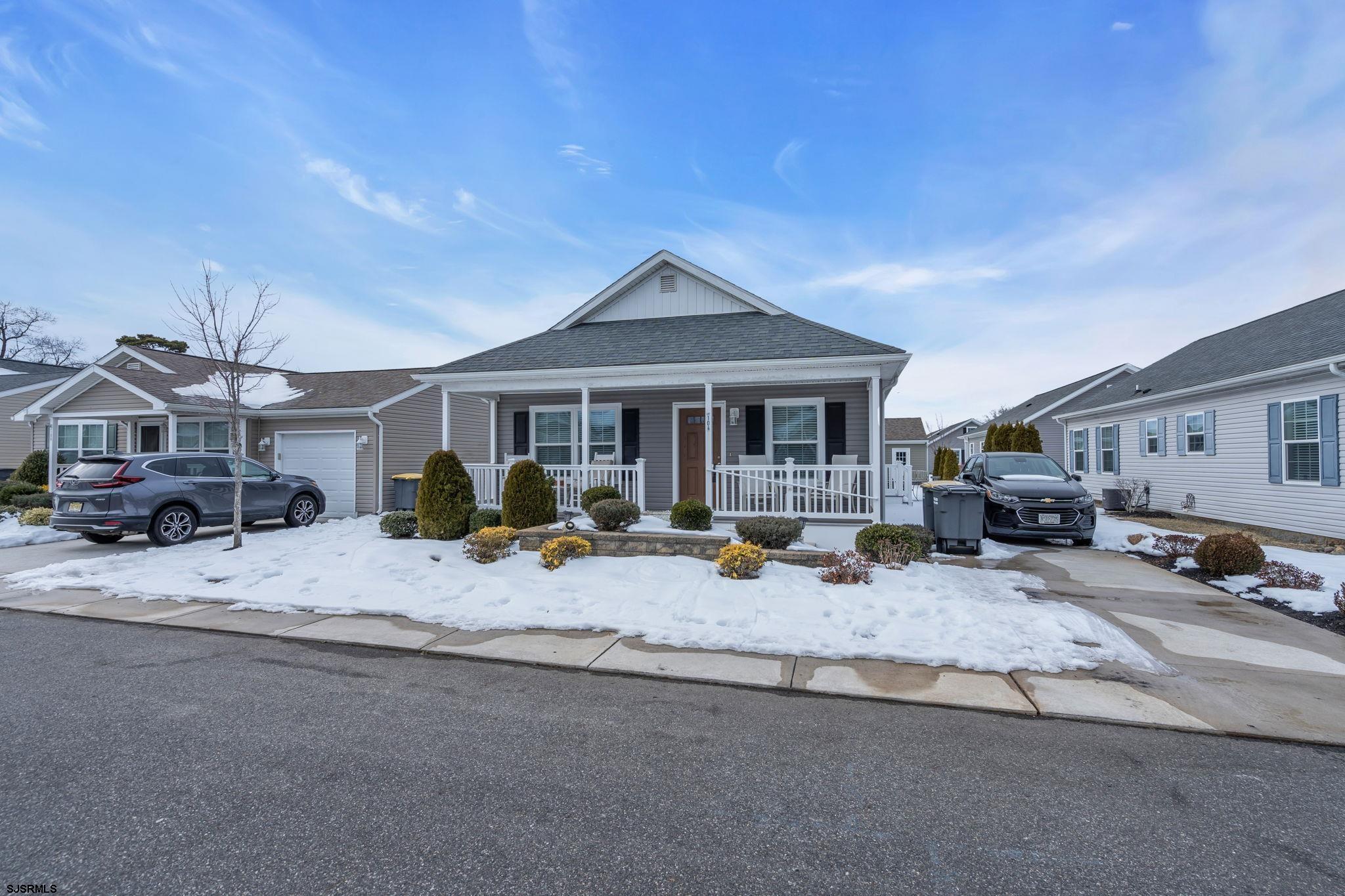 2058 South Shore Road, Unit 104 Marmora, NJ 08230 - Photo 18 of 20 a row of palm trees in front of house