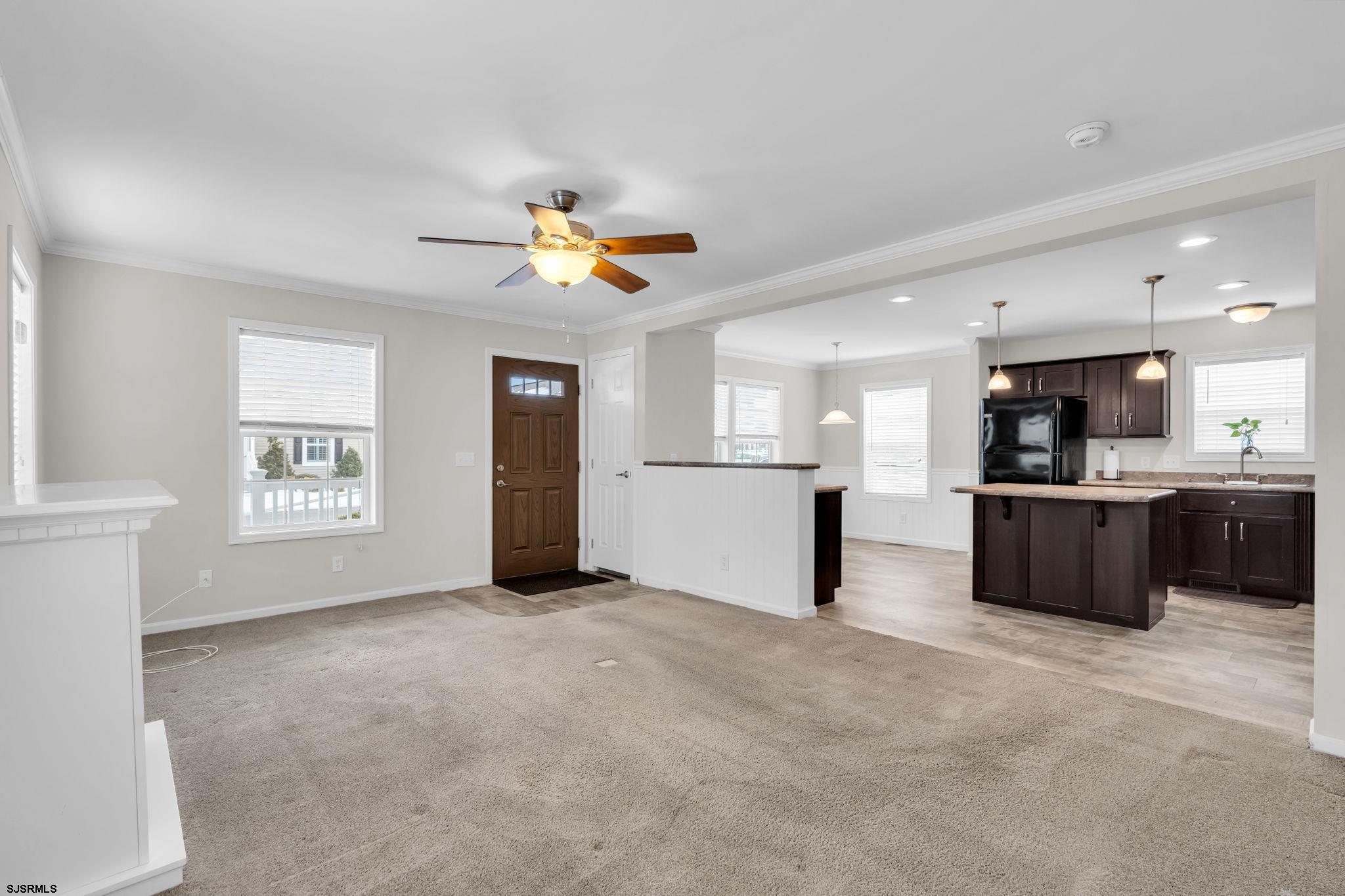 2058 South Shore Road, Unit 104 Marmora, NJ 08230 - Photo 2 of 20 a view of a kitchen with a sink and a window