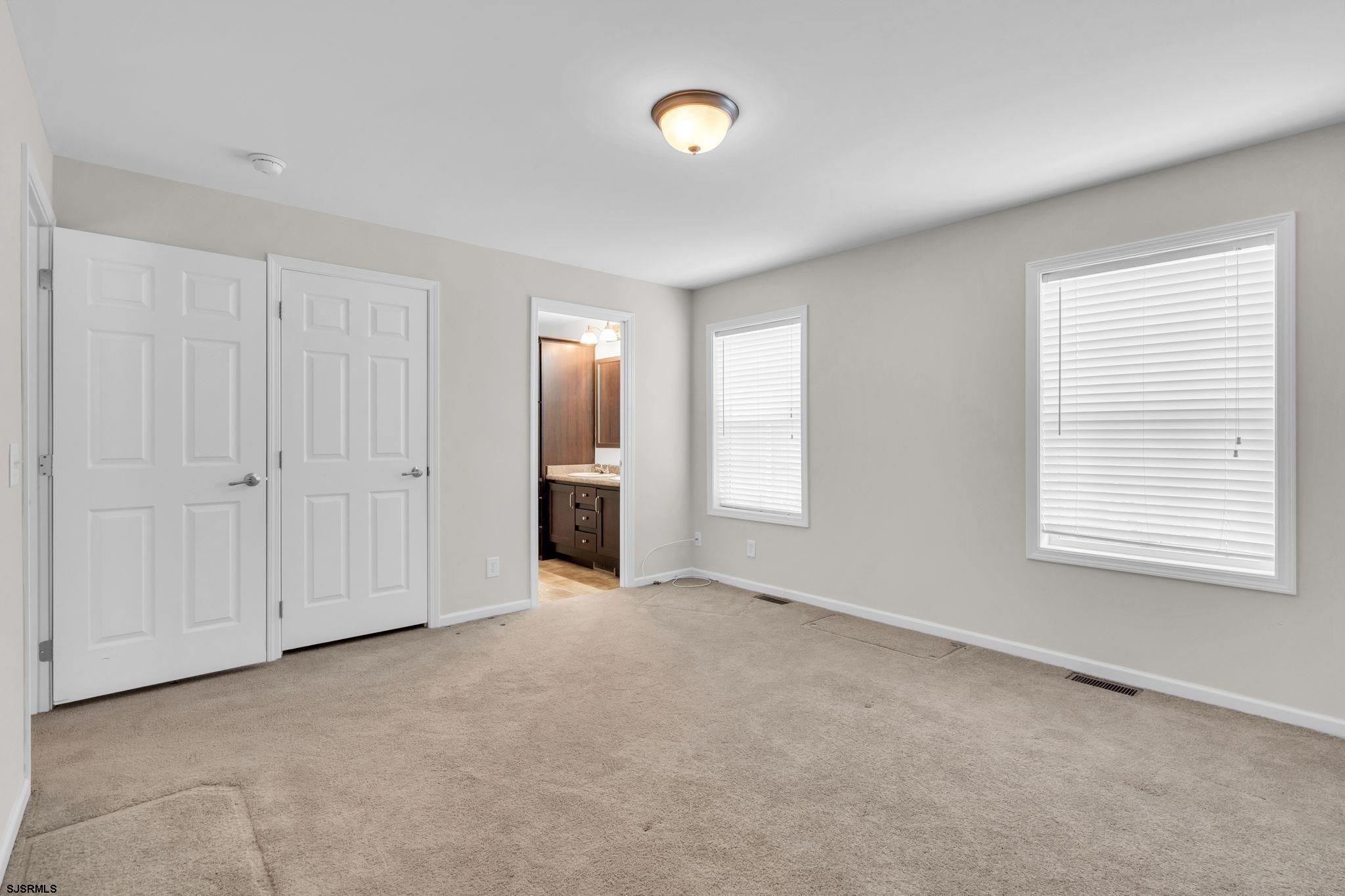 2058 South Shore Road, Unit 104 Marmora, NJ 08230 - Photo 10 of 20 a view of an empty room with a window