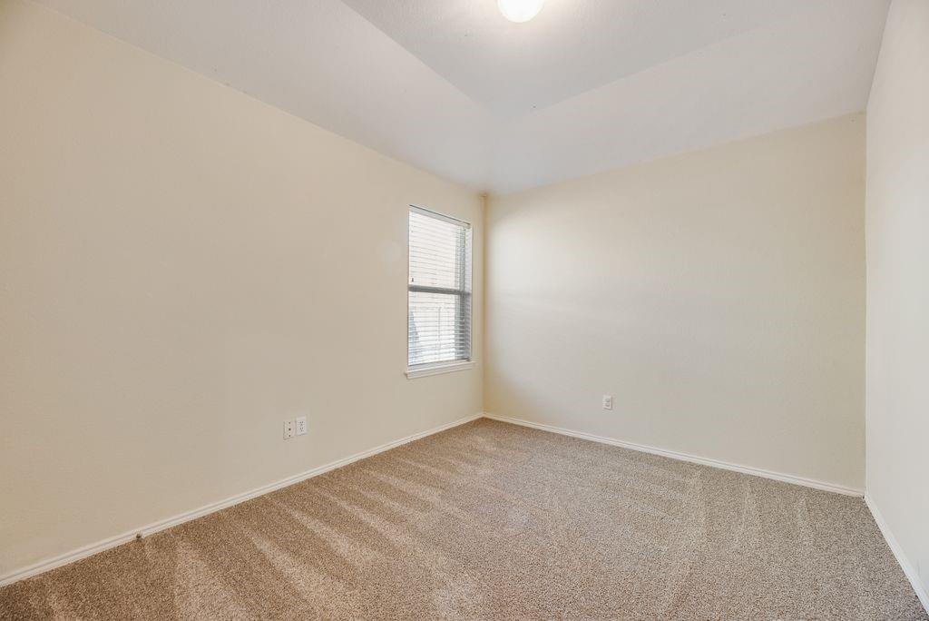 2721 Lone Ranger Trail Little Elm, TX 75068 - Photo 14 of 23 an empty room with a window