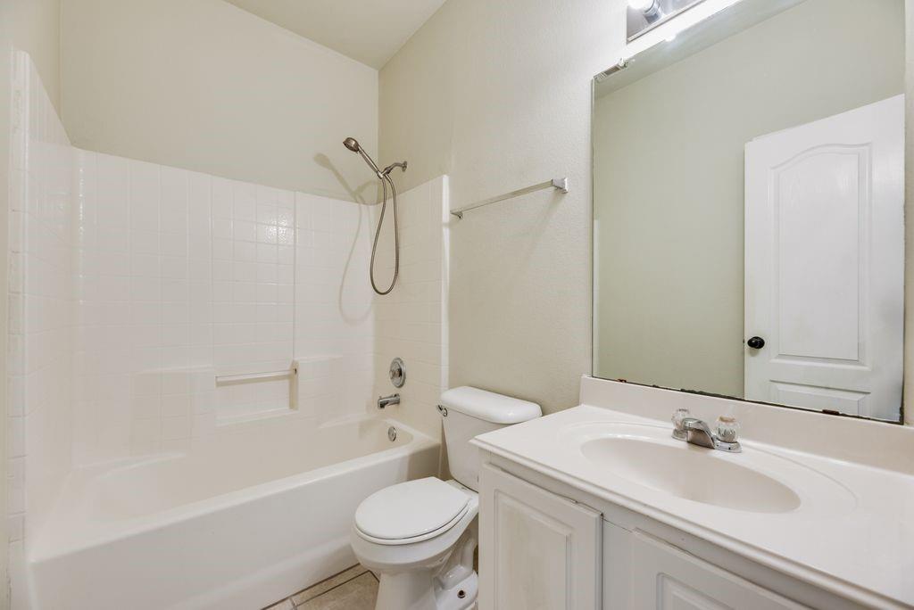 2721 Lone Ranger Trail Little Elm, TX 75068 - Photo 15 of 23 a bathroom with a sink toilet and shower