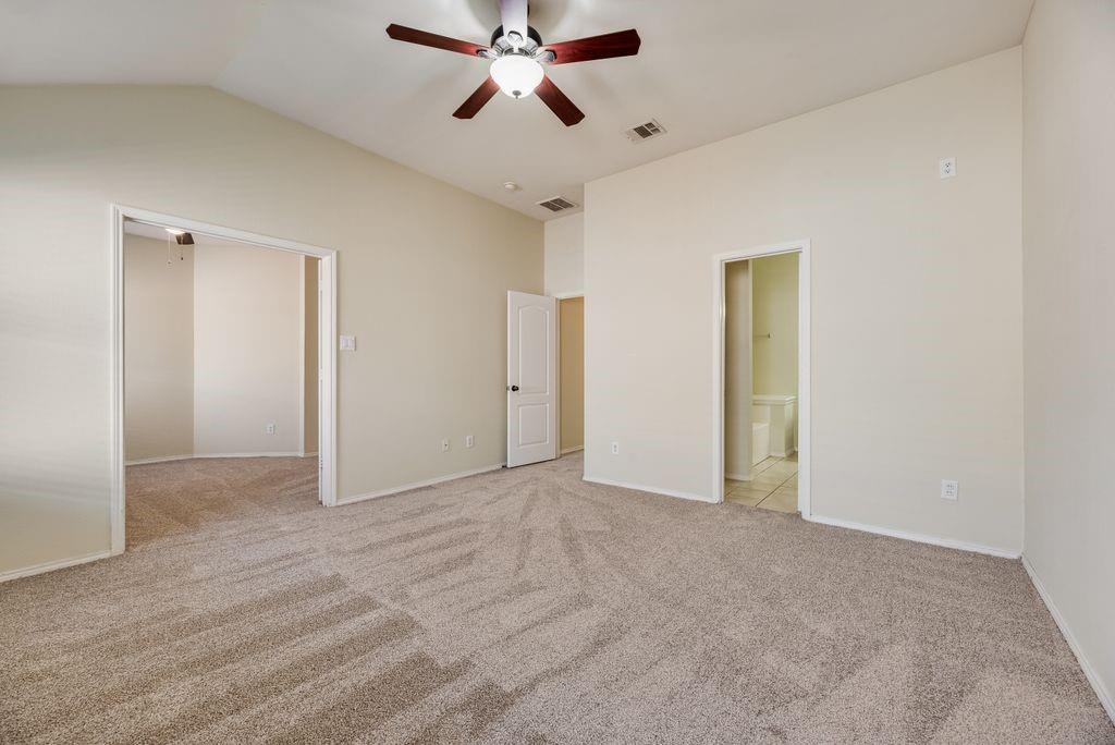 2721 Lone Ranger Trail Little Elm, TX 75068 - Photo 17 of 23 a view of an empty room and chandelier fan
