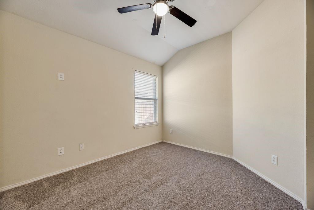 2721 Lone Ranger Trail Little Elm, TX 75068 - Photo 18 of 23 an empty room with windows and ceiling fan
