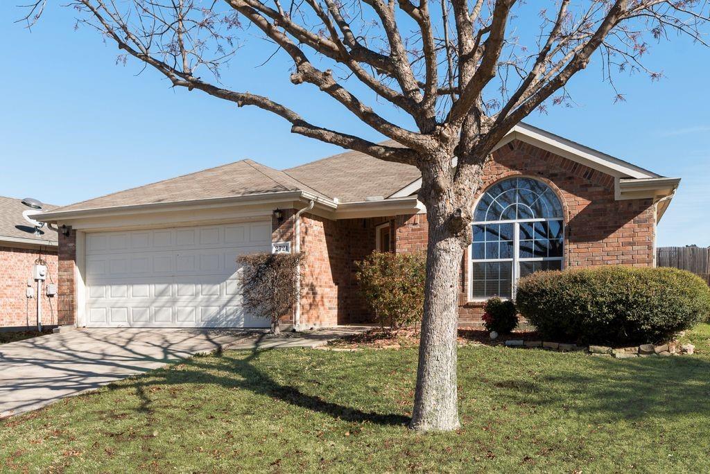2721 Lone Ranger Trail Little Elm, TX 75068 - Photo 2 of 23 a house view with a backyard space