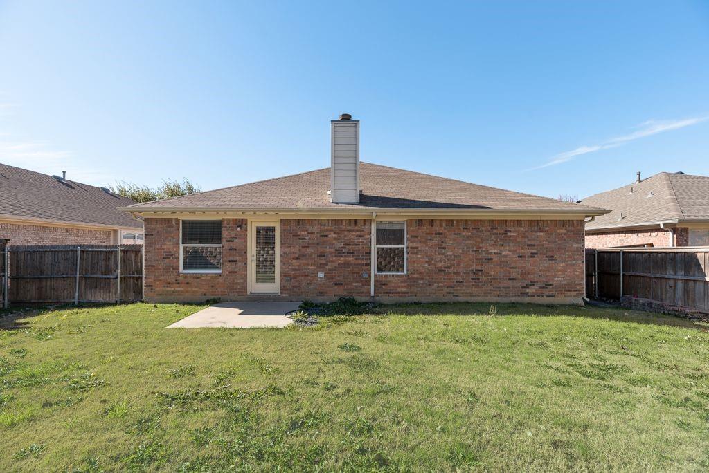 2721 Lone Ranger Trail Little Elm, TX 75068 - Photo 22 of 23 a front view of a house with a yard and garage