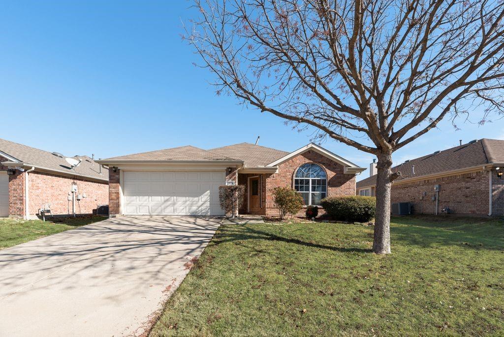 2721 Lone Ranger Trail Little Elm, TX 75068 - Photo 3 of 23 a front view of a house with a yard