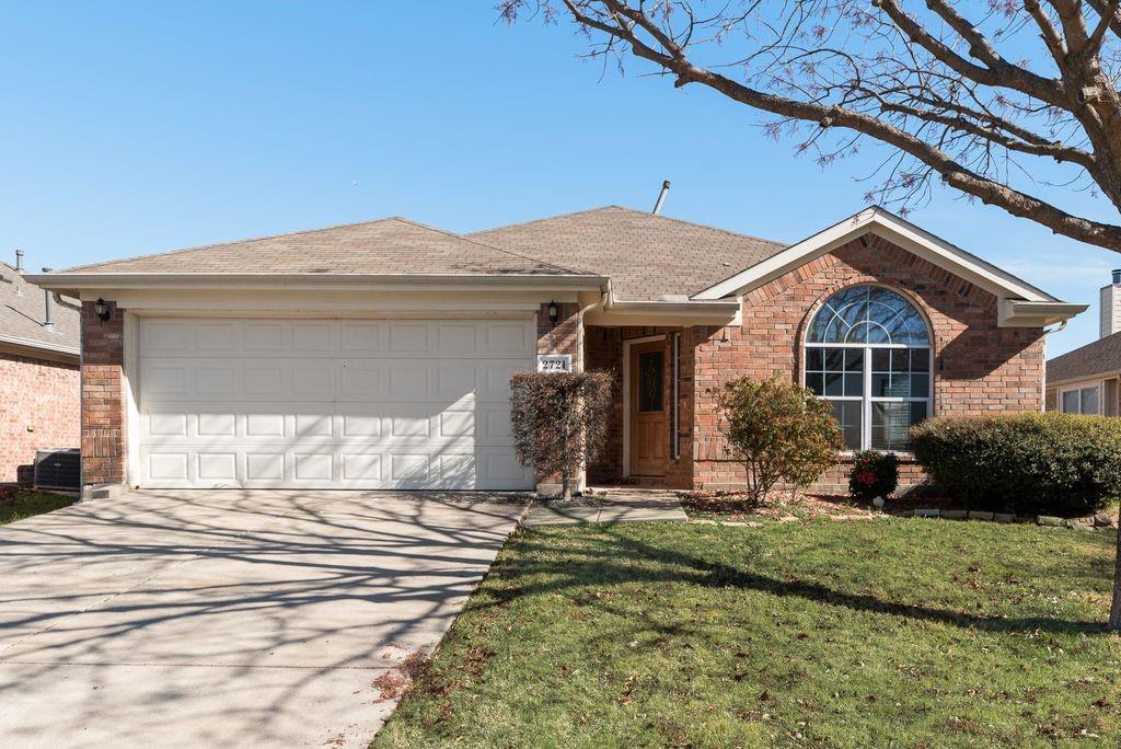 2721 Lone Ranger Trail Little Elm, TX 75068 - Photo 4 of 23 a front view of a house with a yard