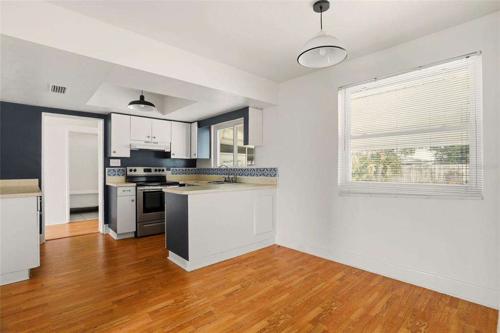 404 West Whidden Street Arcadia, FL 34266 - Photo 11 of 34 a kitchen with stainless steel appliances granite countertop a stove a sink and a refrigerator