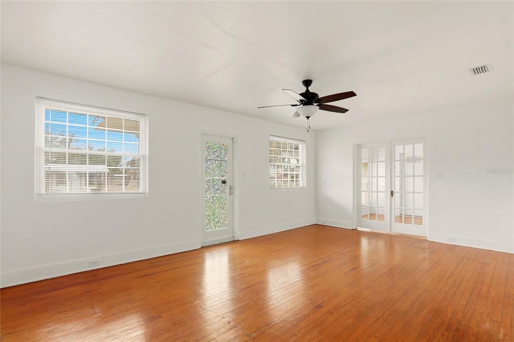 404 West Whidden Street Arcadia, FL 34266 - Photo 13 of 34 wooden floor in an empty room with a window