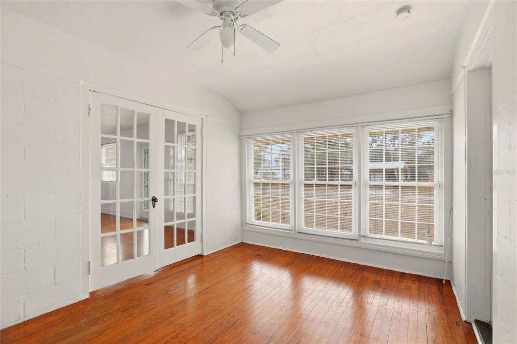 404 West Whidden Street Arcadia, FL 34266 - Photo 14 of 34 a view of empty room with wooden floor and fan