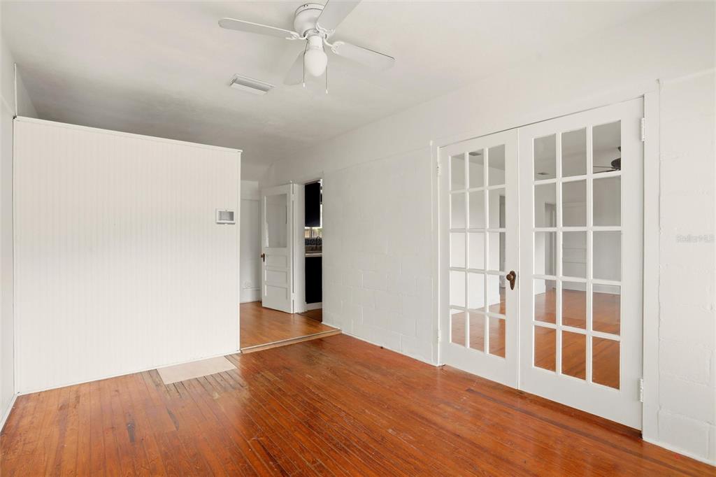 404 West Whidden Street Arcadia, FL 34266 - Photo 15 of 34 a view of empty room with wooden floor and fan