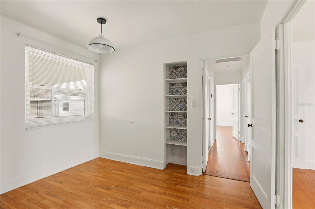 404 West Whidden Street Arcadia, FL 34266 - Photo 17 of 34 a view of empty room with wooden floor and fan