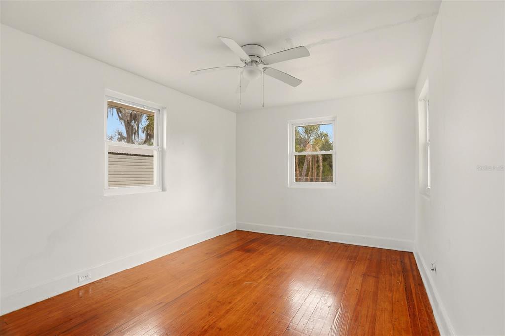 404 West Whidden Street Arcadia, FL 34266 - Photo 19 of 34 an empty room with a window and a ceiling fan