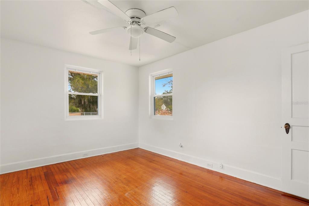 404 West Whidden Street Arcadia, FL 34266 - Photo 20 of 34 an empty room with a window and a ceiling fan