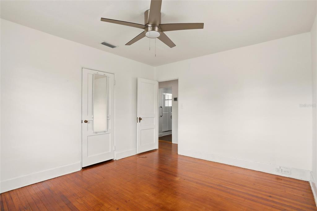 404 West Whidden Street Arcadia, FL 34266 - Photo 23 of 34 a view of an empty room with wooden floor